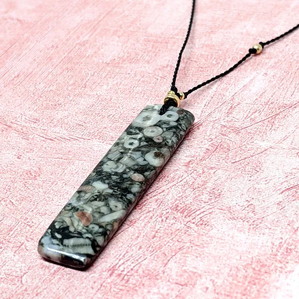 Mottled Black Crinoid Fossil Rectangle Cutstone Pendant