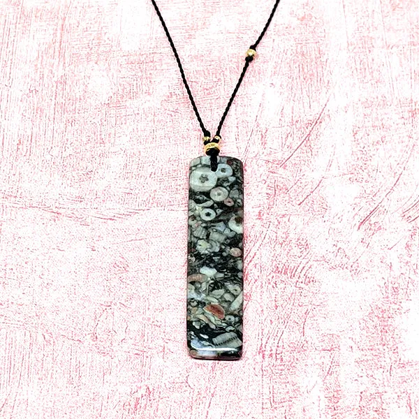 Mottled Black Crinoid Fossil Rectangle Cutstone Pendant